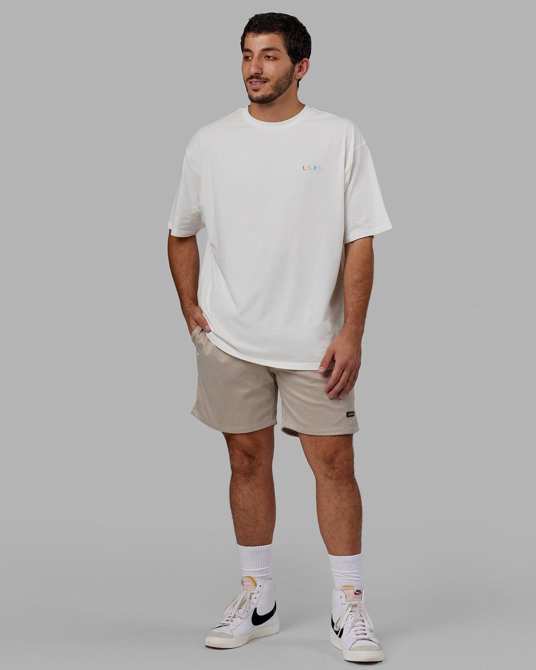 Man wearing Unisex Amplify FLXCotton Tee Oversize - Off White
