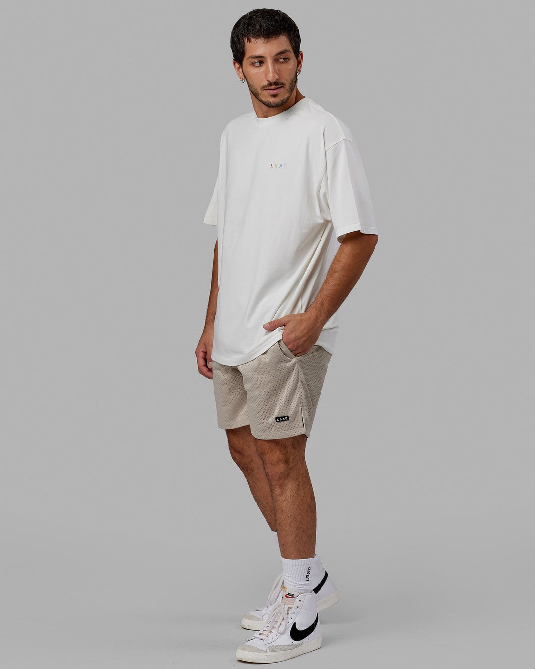 Man wearing Unisex Amplify FLXCotton Tee Oversize - Off White