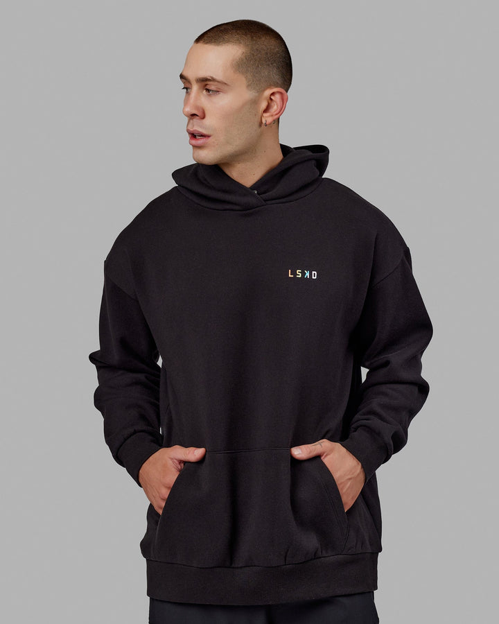 Man wearing Unisex Amplify Hoodie Oversize - Pride-Black