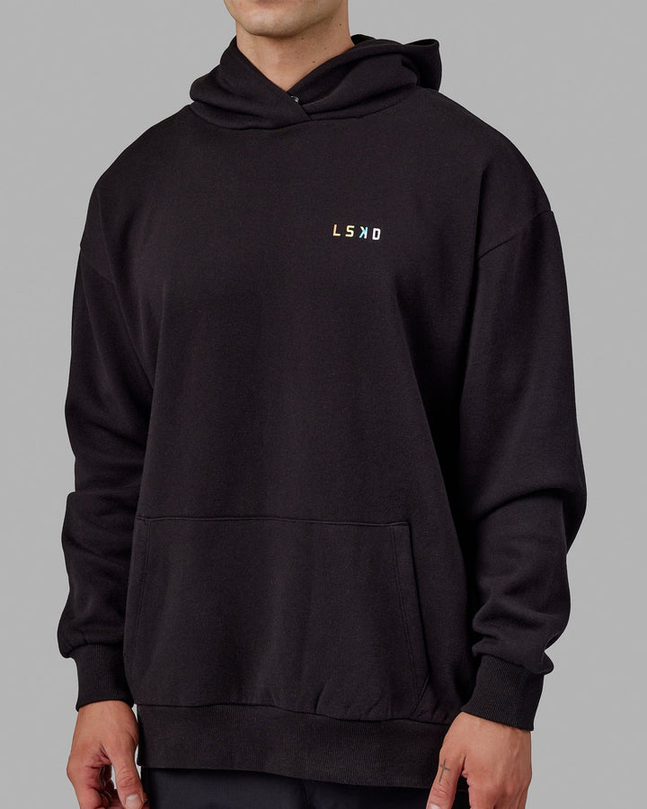 Man wearing Unisex Amplify Hoodie Oversize - Pride-Black