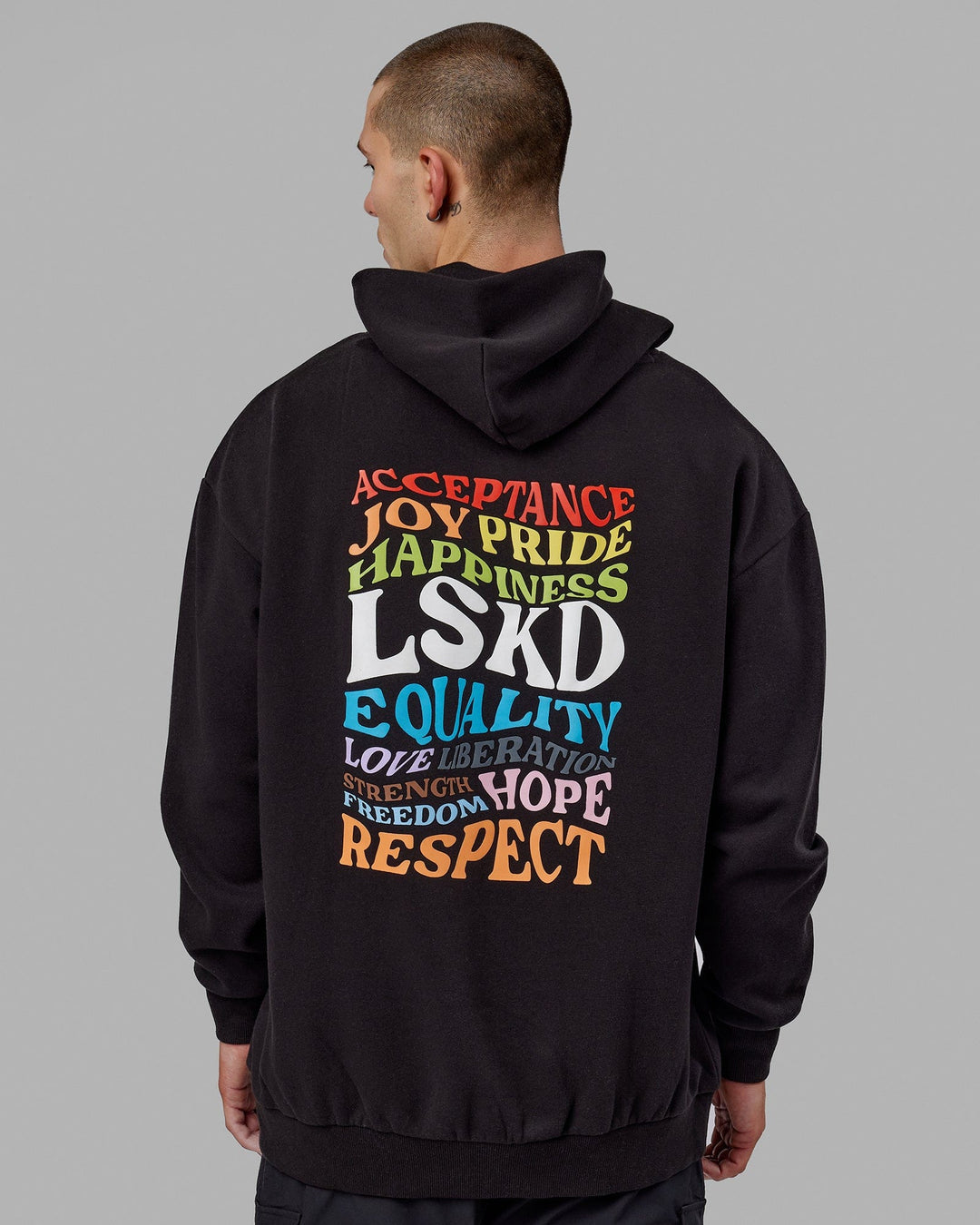 Man wearing Unisex Amplify Hoodie Oversize - Pride-Black