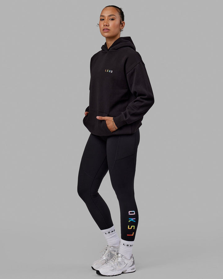 Woman wearing Unisex Amplify Hoodie Oversize - Pride-Black