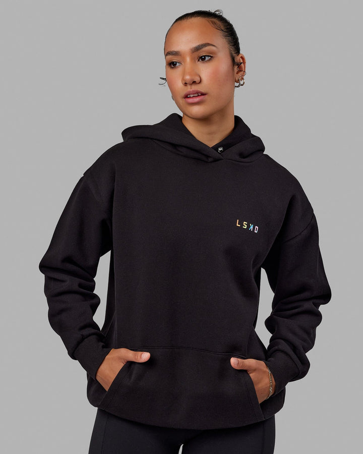 Woman wearing Unisex Amplify Hoodie Oversize - Pride-Black