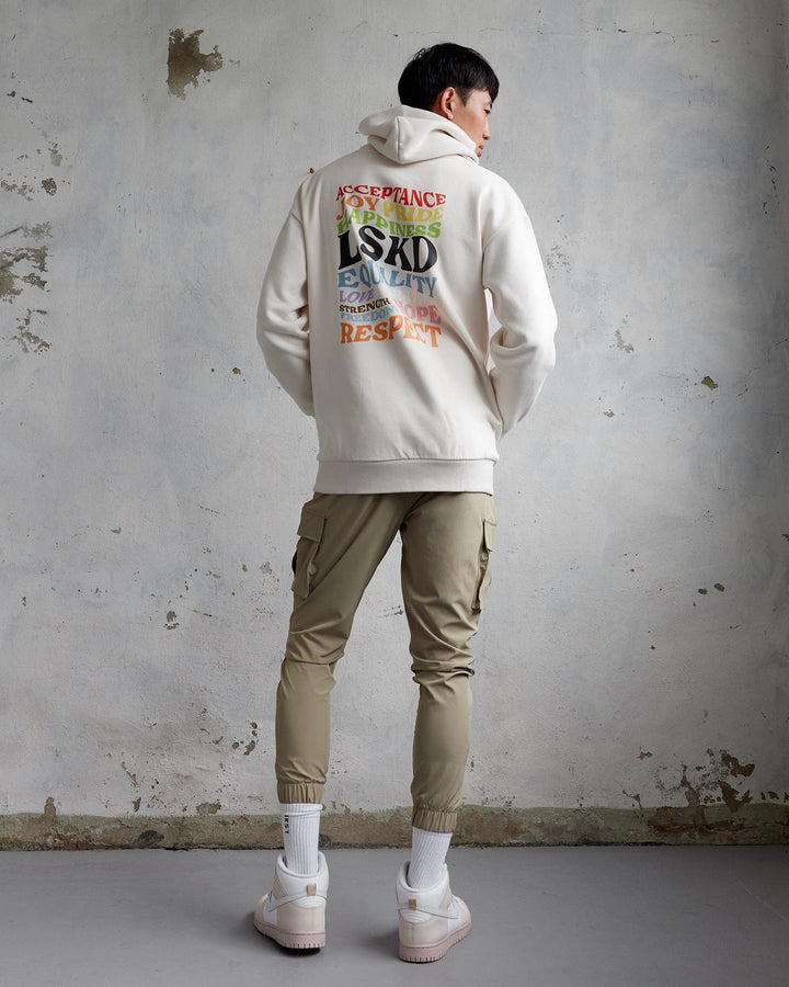 Man wearing Unisex Amplify Hoodie Oversize - Pride-Off White