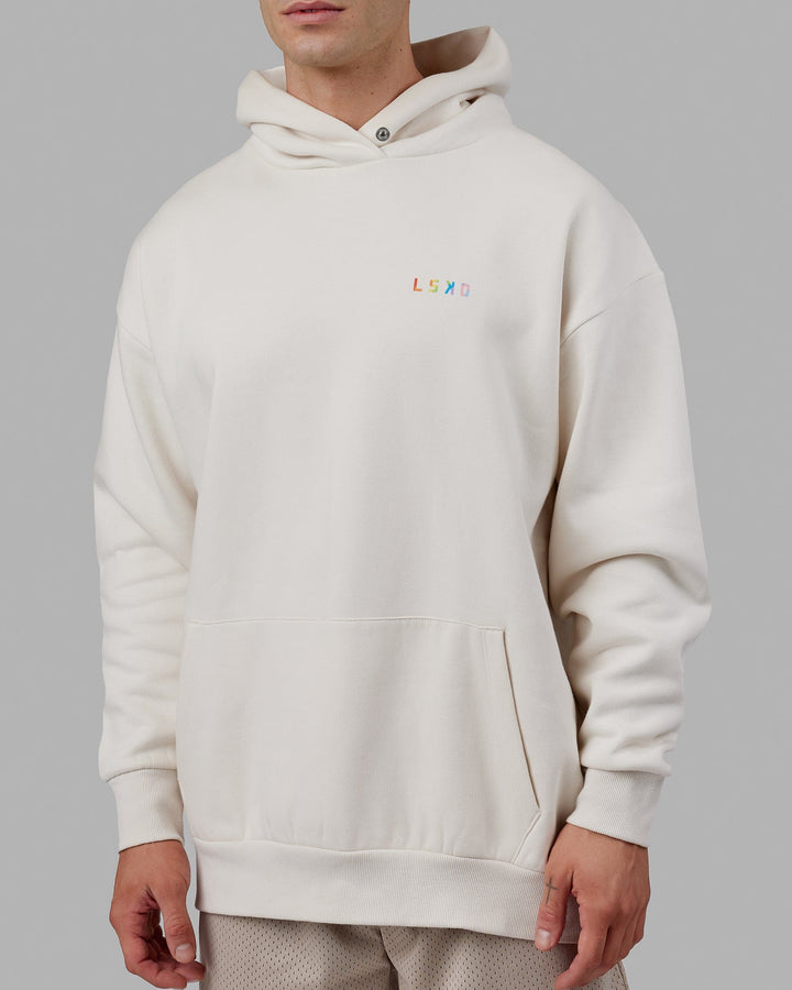 Man wearing Unisex Amplify Hoodie Oversize - Pride-Off White