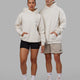 Duo wearing Unisex Amplify Hoodie Oversize - Pride-Off White