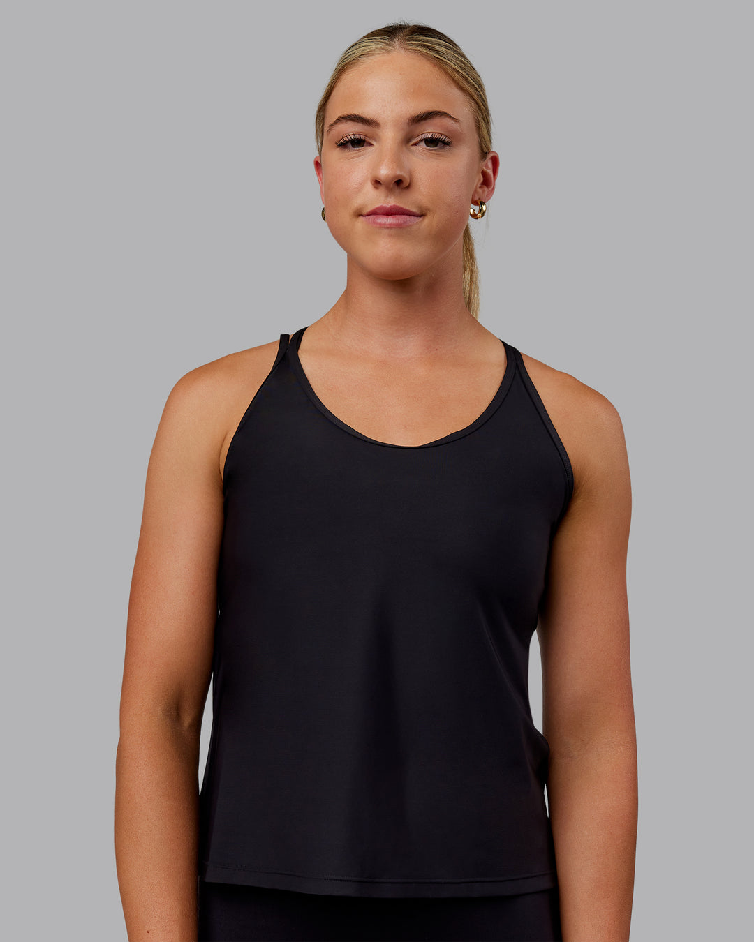 Woman wearing Apex Lightweight Performance Tank - Black
