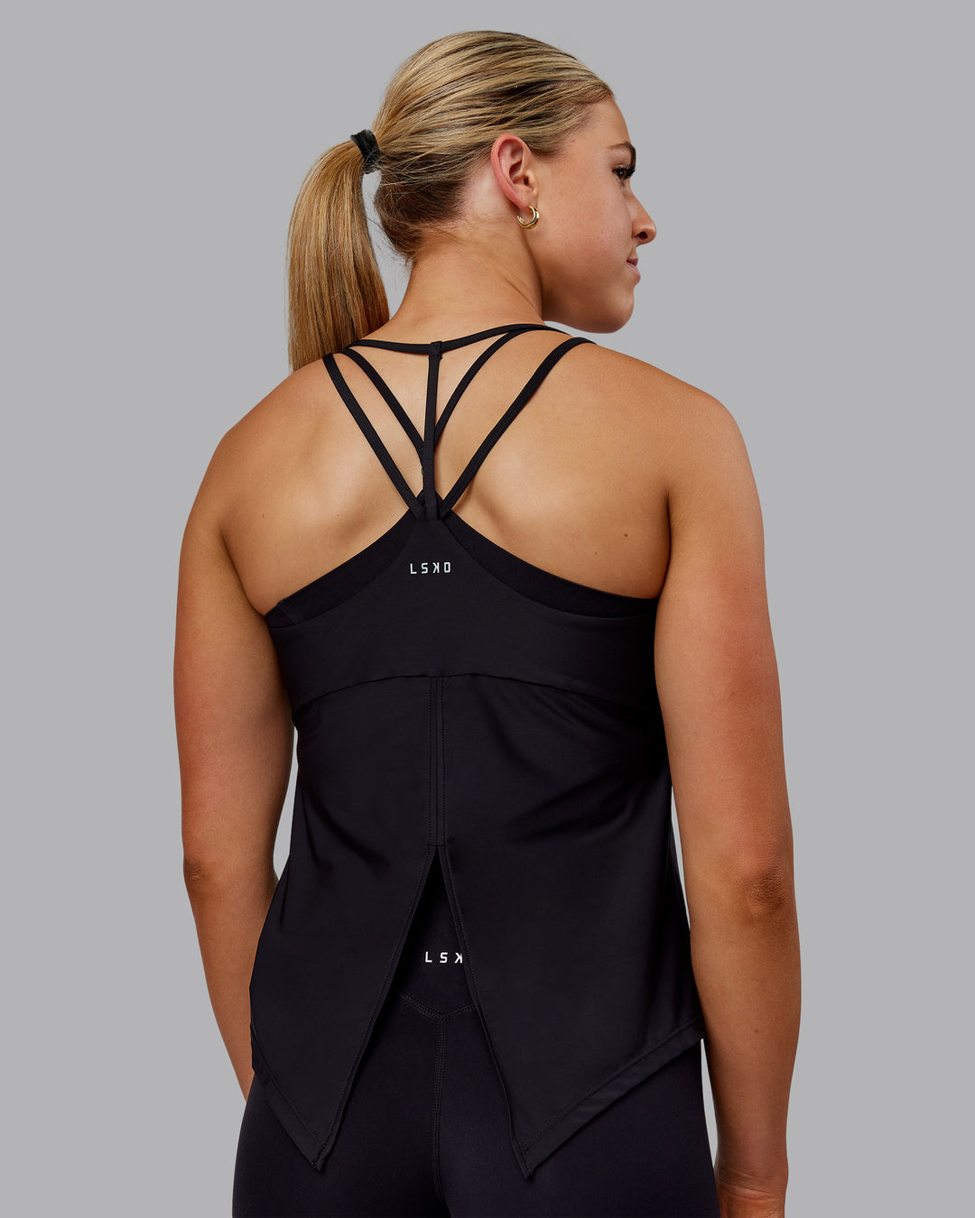 Woman wearing Apex Lightweight Performance Tank - Black