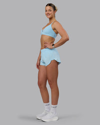 Woman wearing Ascend Sports Bra - Crystal Blue