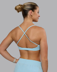 Woman wearing Ascend Sports Bra - Crystal Blue