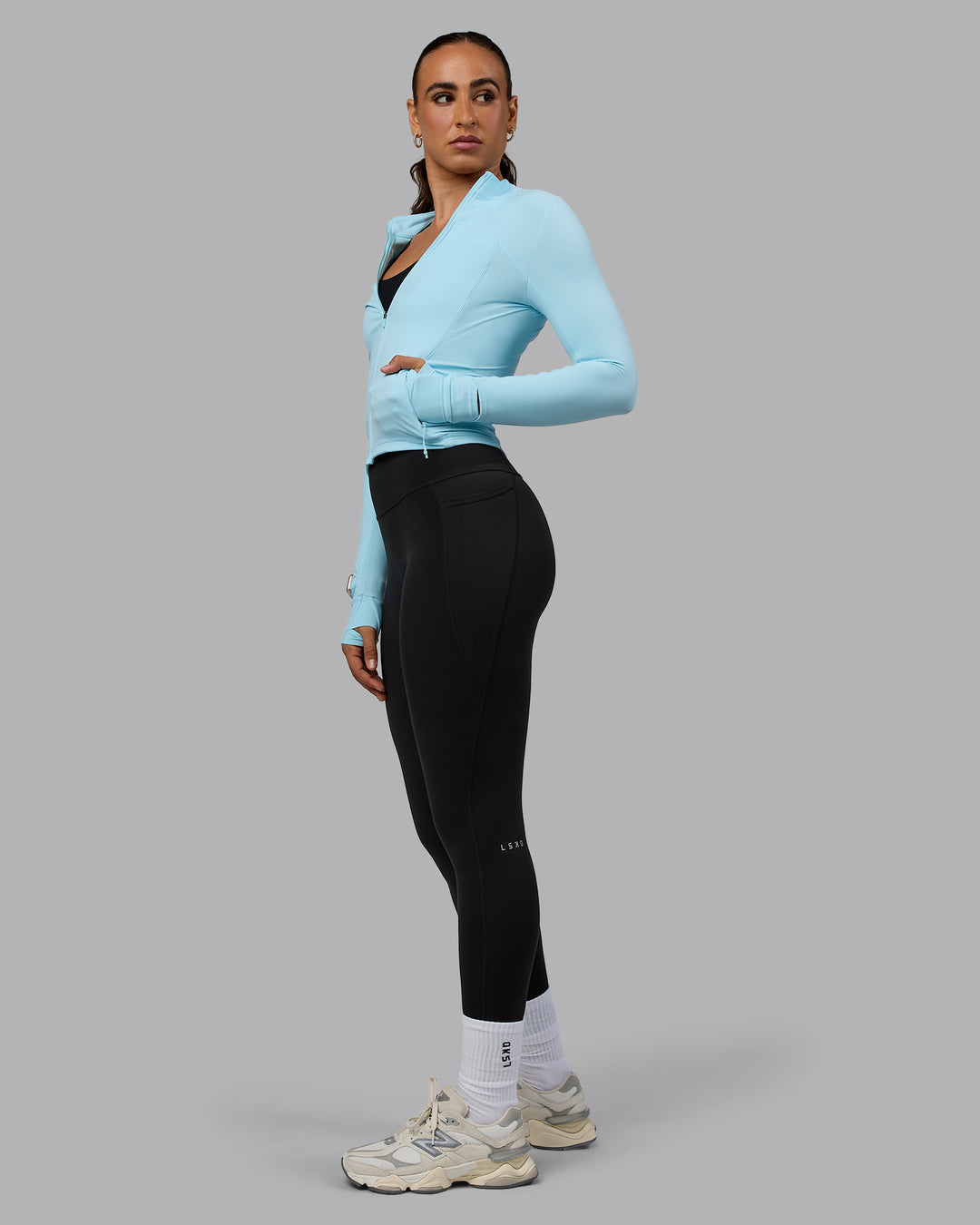Woman wearing Aspire Jacket - Crystal Blue