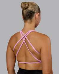 Woman wearing Aspire Sports Bra - Bubblegum
