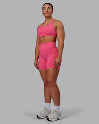 Woman wearing Aspire Sports Bra - Carmine Rose