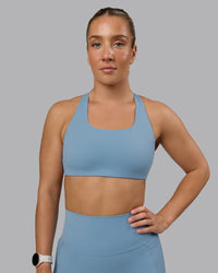 Woman wearing Aspire Sports Bra - Glacier Lake