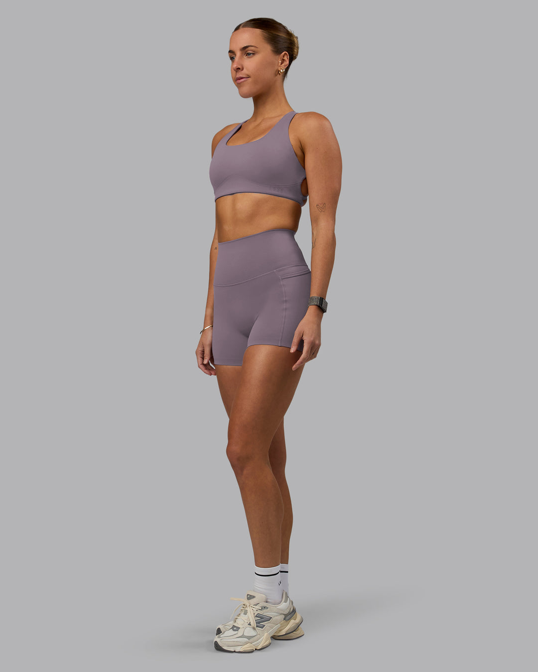 Woman wearing Aspire Sports Bra - Purple Sage