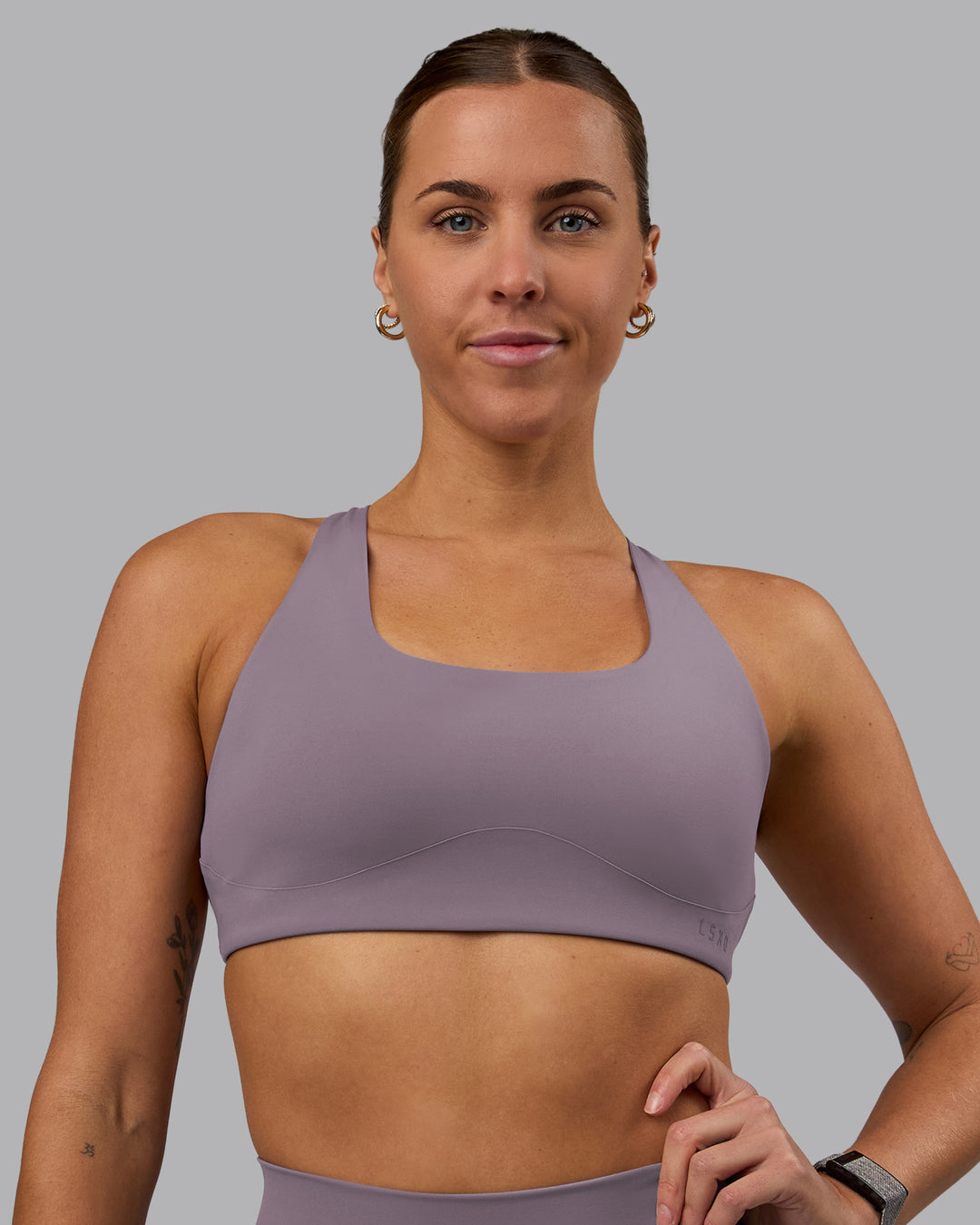 Woman wearing Aspire Sports Bra - Purple Sage
