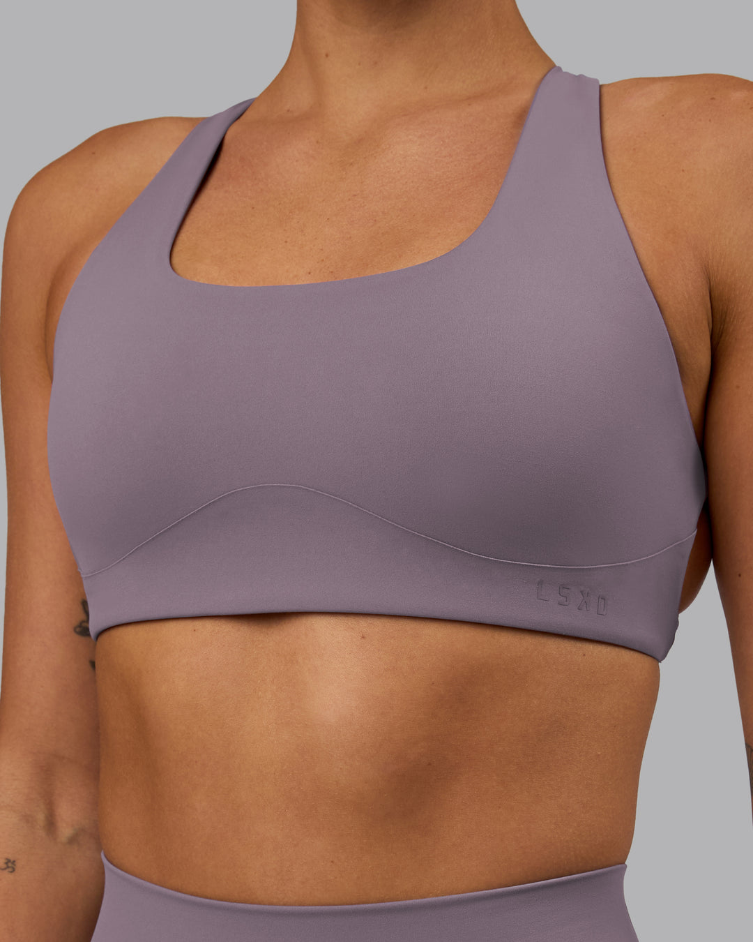 Woman wearing Aspire Sports Bra - Purple Sage