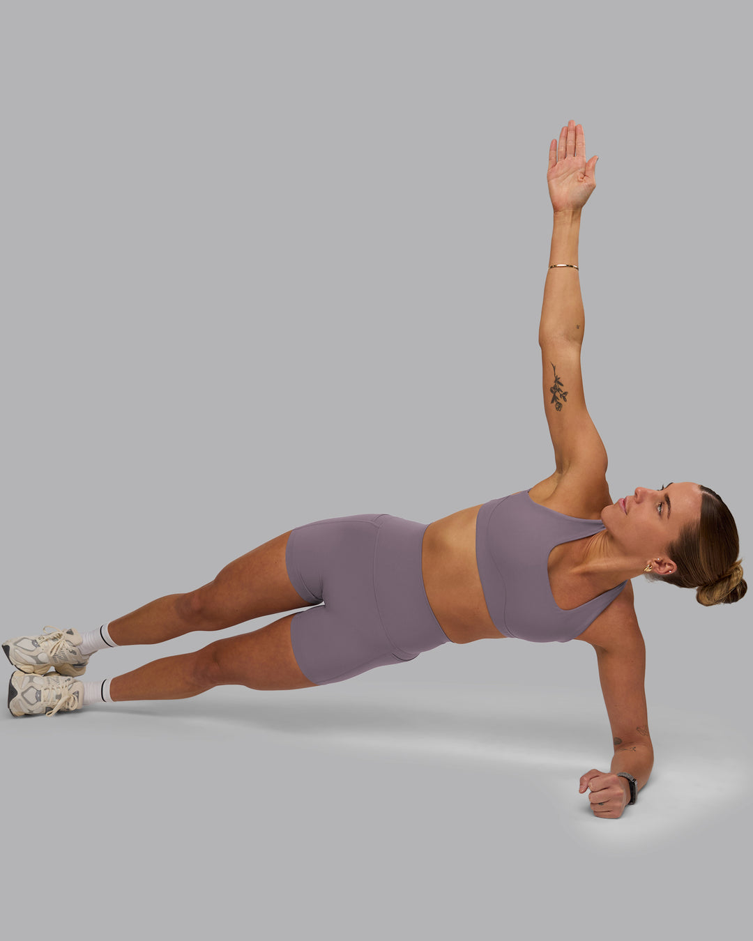 Woman wearing Aspire Sports Bra - Purple Sage