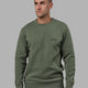 Man wearing Athlete ForgedFleece Sweater - Dark Forest