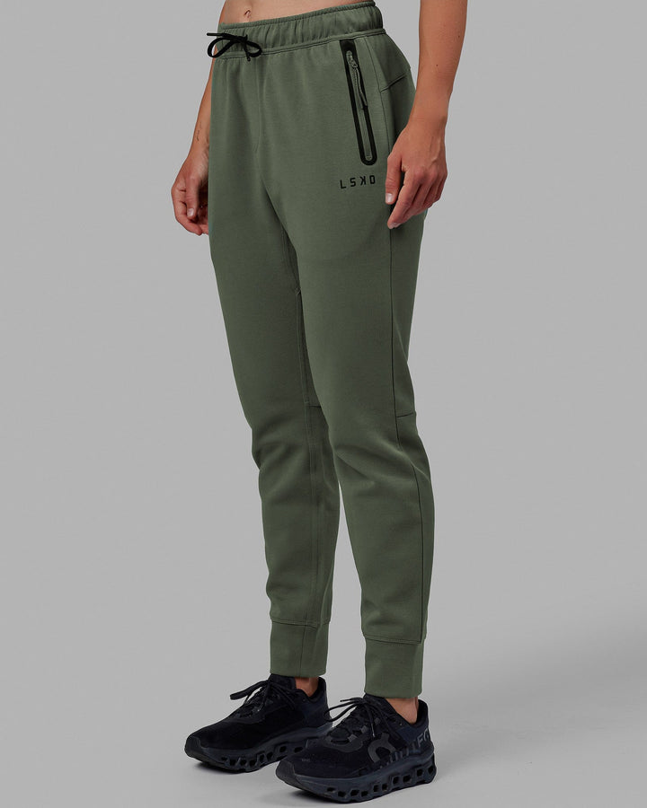 Woman wearing Womens Athlete ForgedFleece Track Pants - Dark Forest