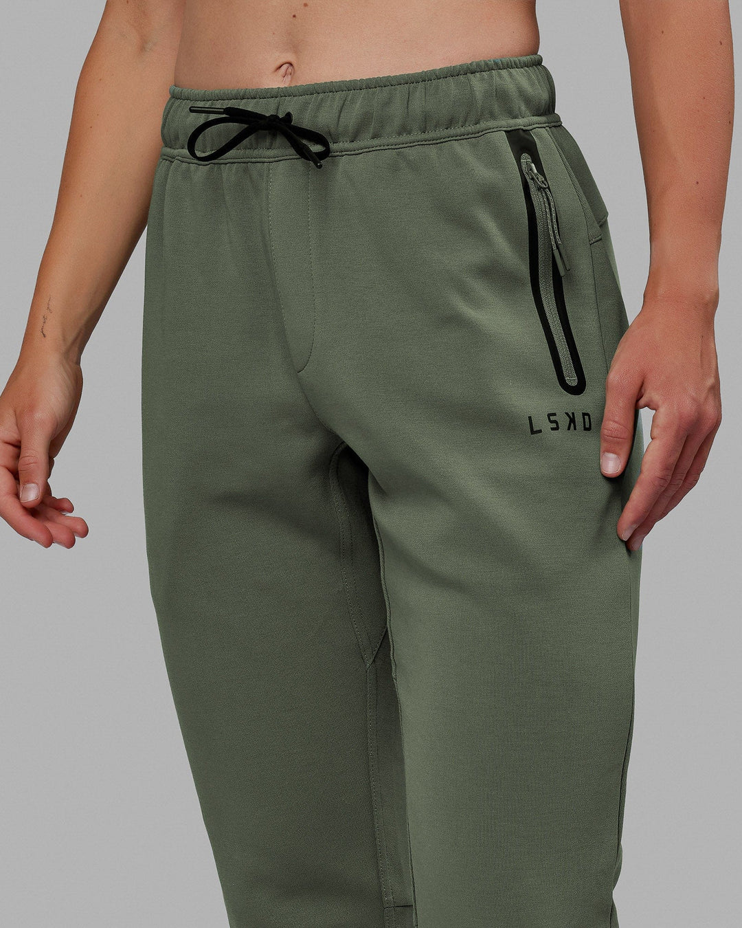 Woman wearing Womens Athlete ForgedFleece Track Pants - Dark Forest