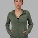 Woman wearing Athlete ForgedFleece Zip Through Hoodie - Dark Forest