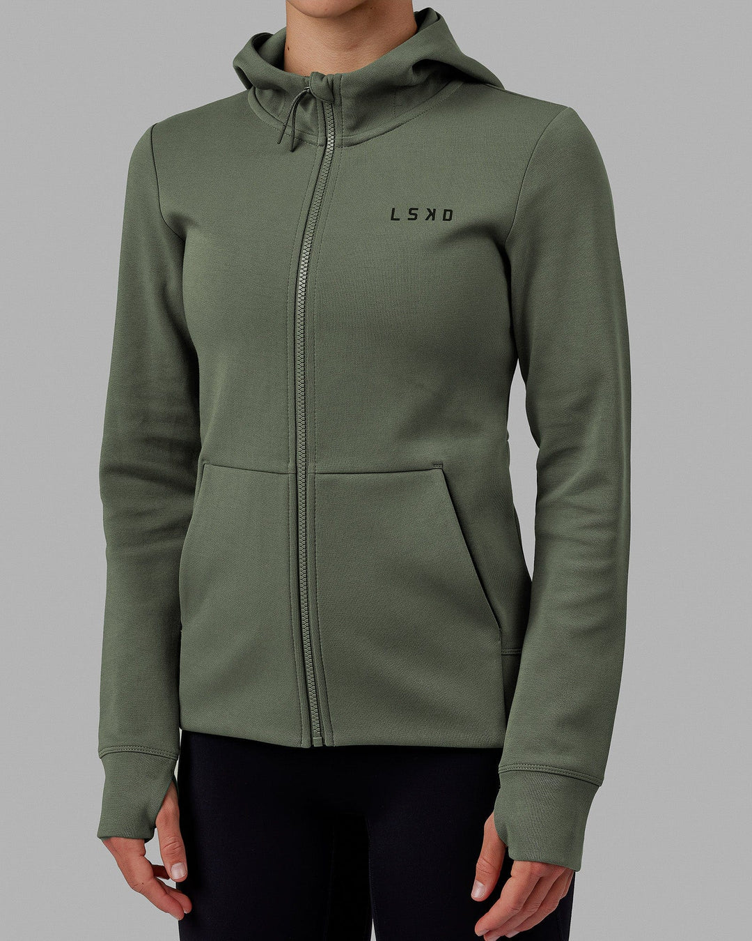 Woman wearing Athlete ForgedFleece Zip Through Hoodie - Dark Forest