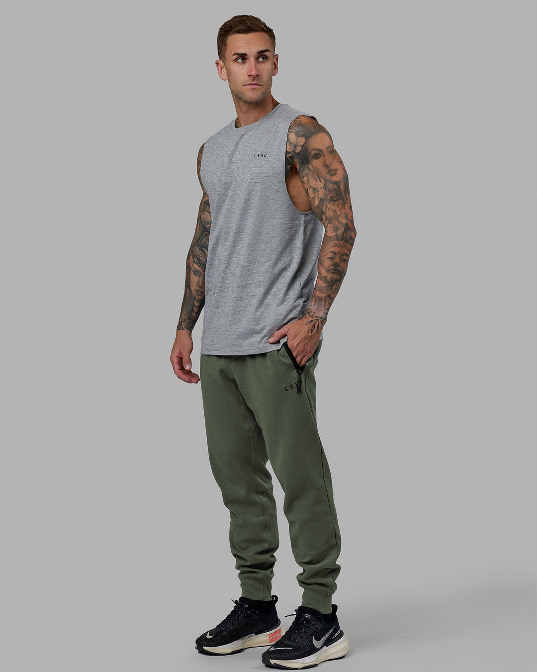 Man wearing Athlete ForgedFleece Zip Track Pants - Dark Forest