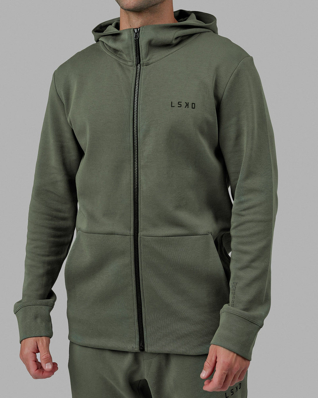 Man wearing Athlete ForgedFleece Zip Up Hoodie - Dark Forest