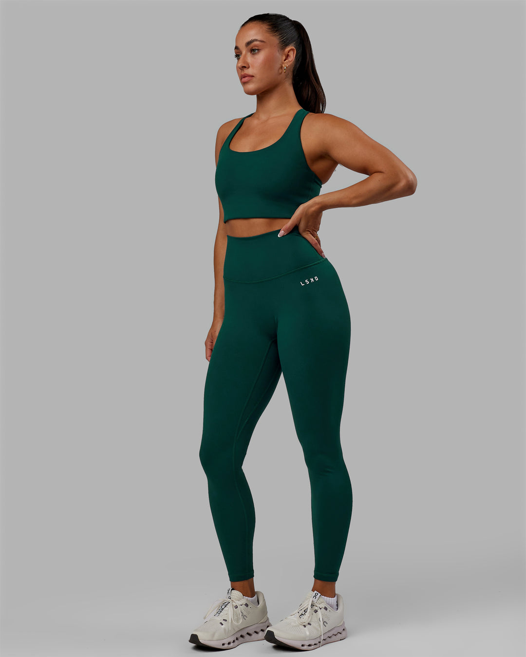 Woman wearing Base 2.0 Full Length Tights - Dark Moss