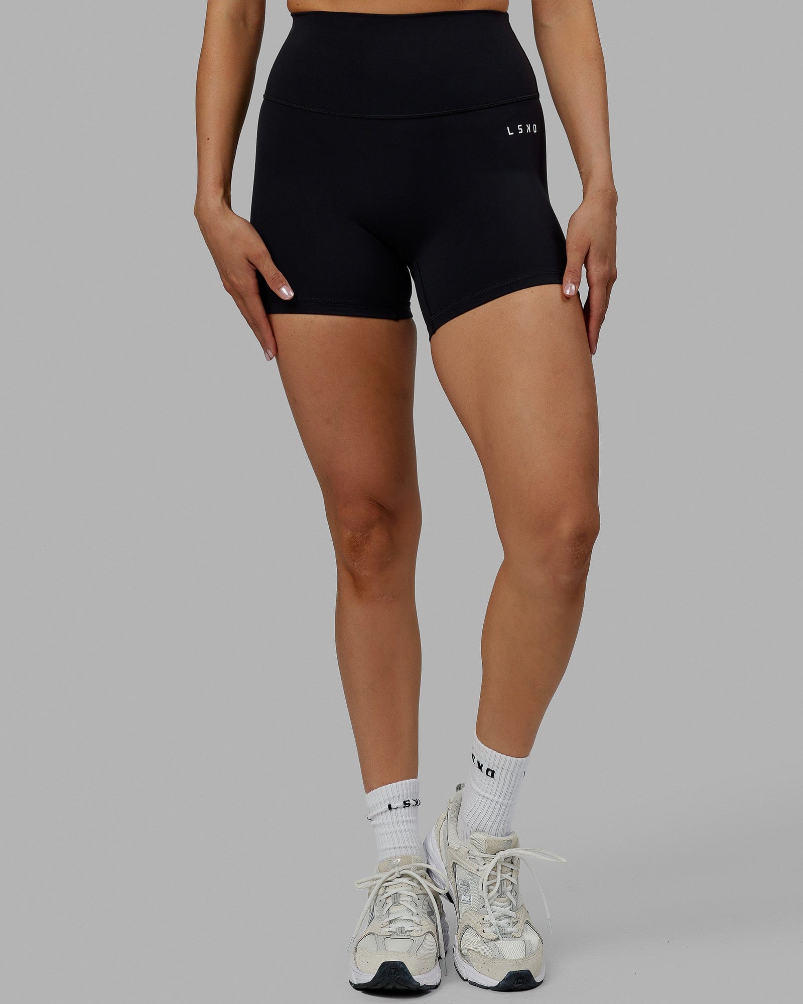 Woman wearing Base 2.0 Ultra High-Rise 4" Short - Black