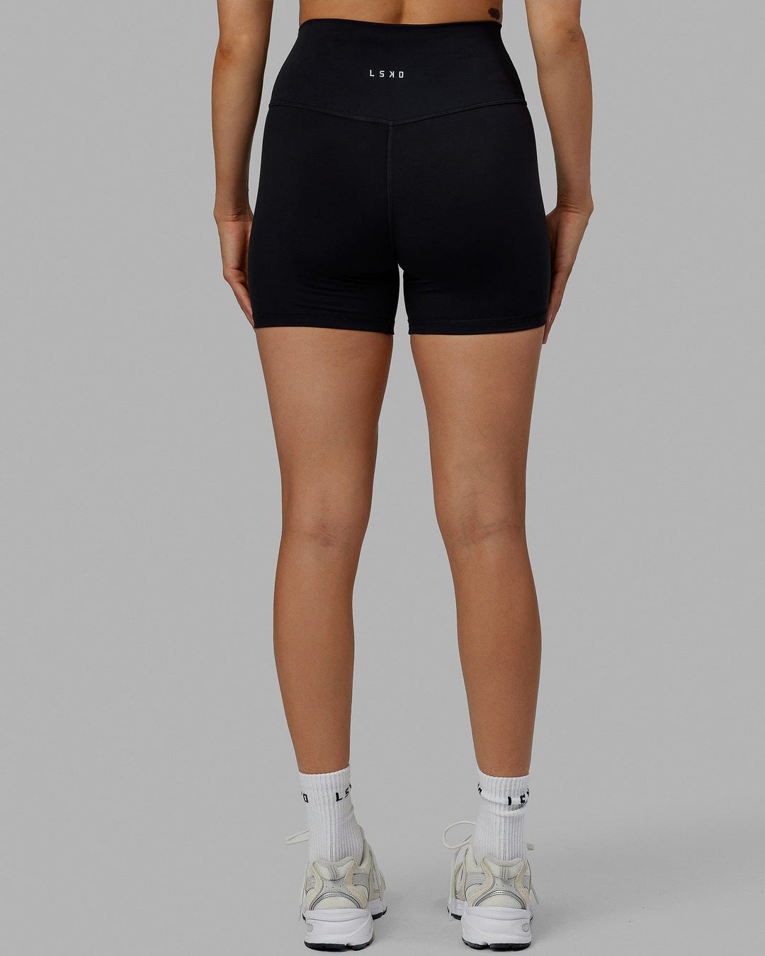 Woman wearing Base 2.0 Ultra High-Rise 4&quot; Short - Black