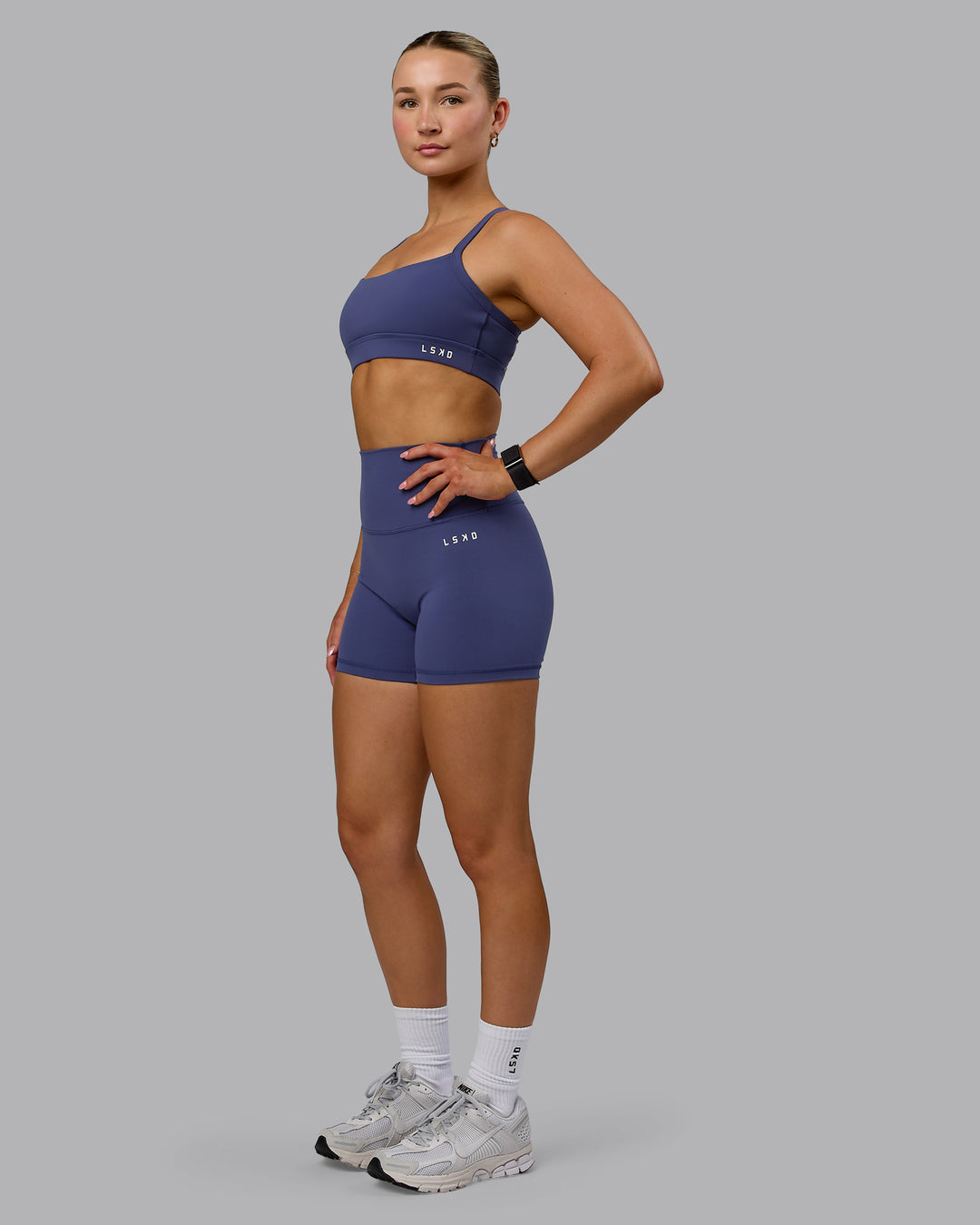 Woman wearing Base 2.0 Ultra High-Rise 4&quot; Short - Future Dusk
