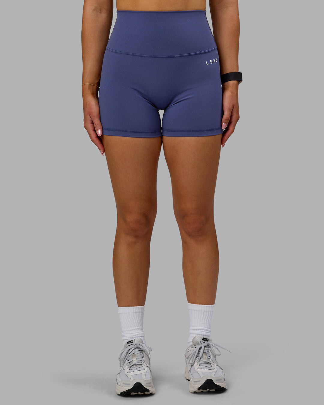 Woman wearing Base 2.0 Ultra High-Rise 4&quot; Short - Future Dusk