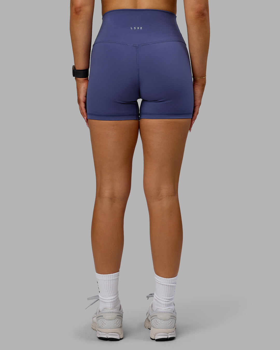 Woman wearing Base 2.0 Ultra High-Rise 4&quot; Short - Future Dusk