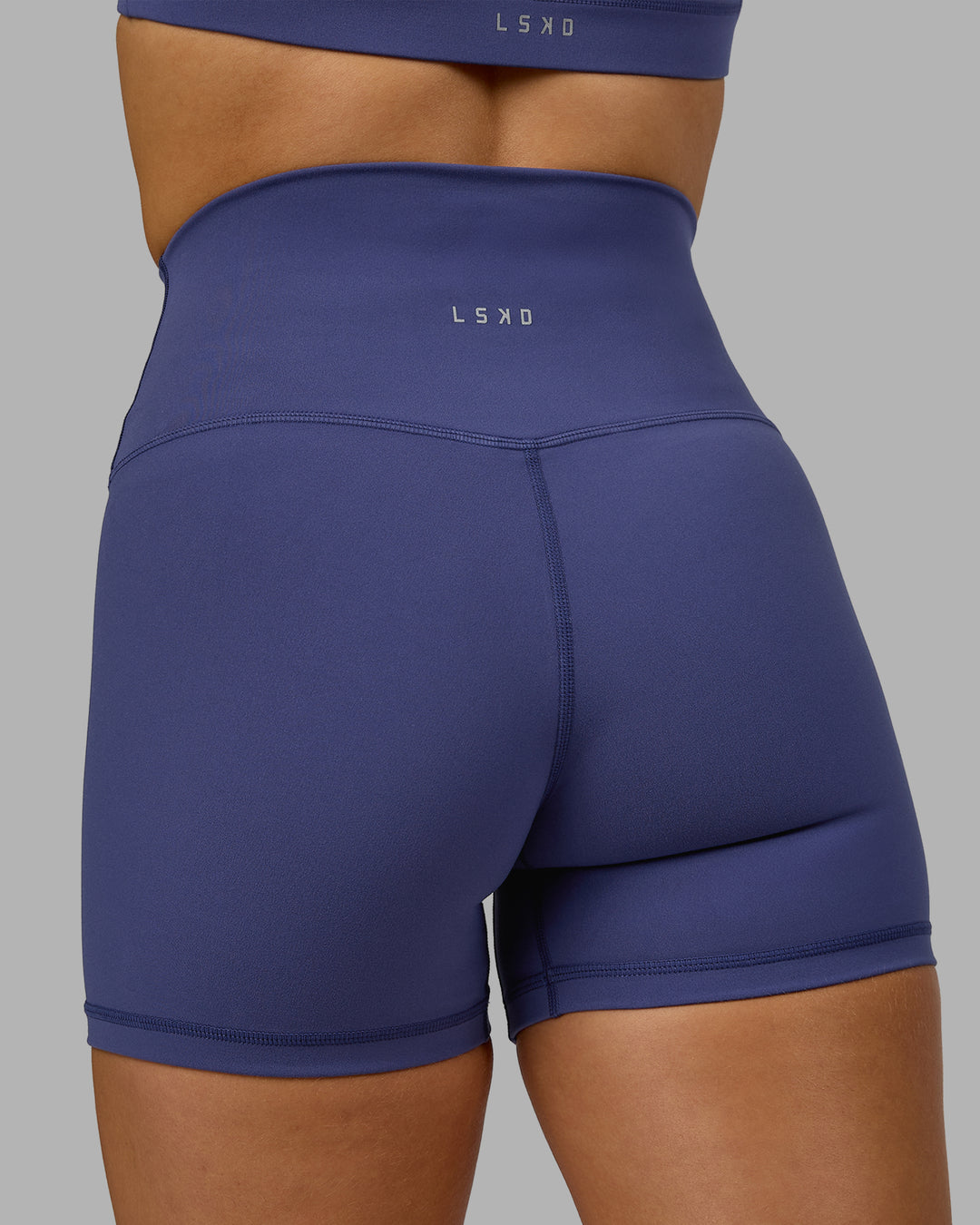 Woman wearing Base 2.0 Ultra High-Rise 4&quot; Short - Future Dusk