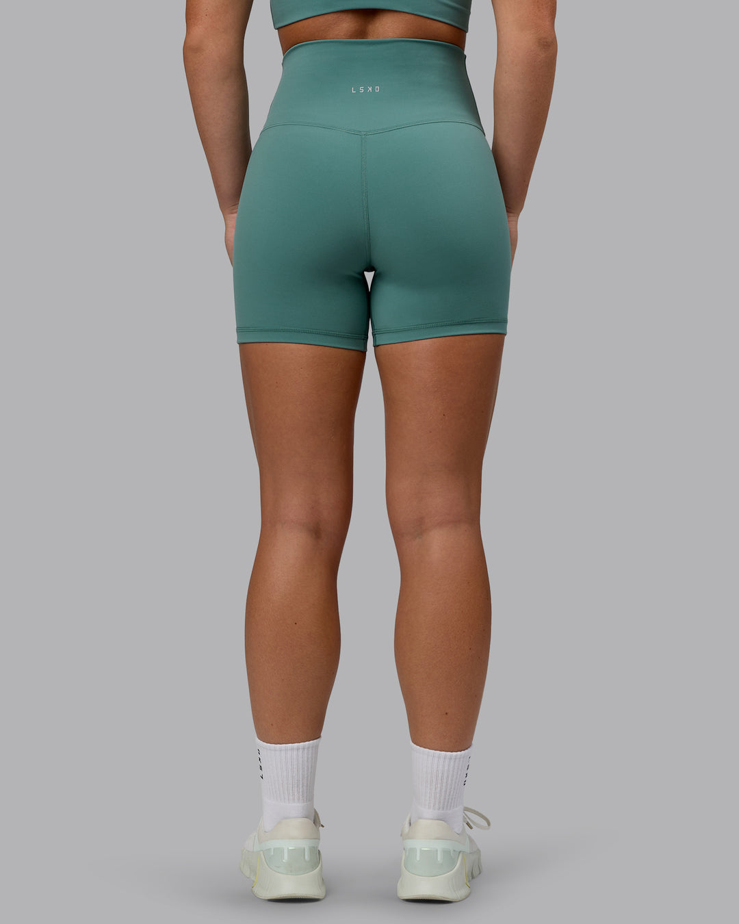 Woman wearing Base 2.0 Ultra High-Rise 4&quot; Short - Sagebrush