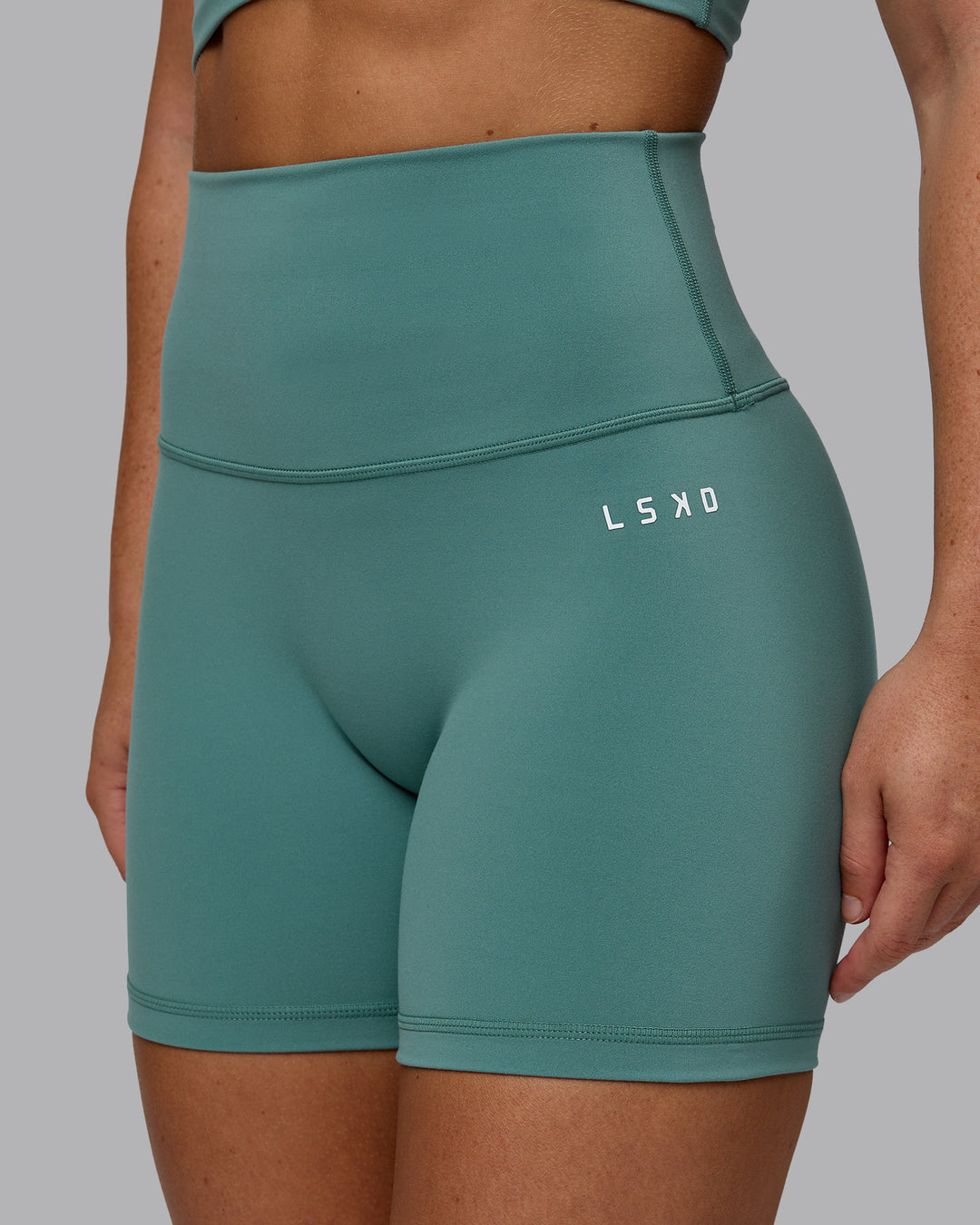 Woman wearing Base 2.0 Ultra High-Rise 4&quot; Short - Sagebrush