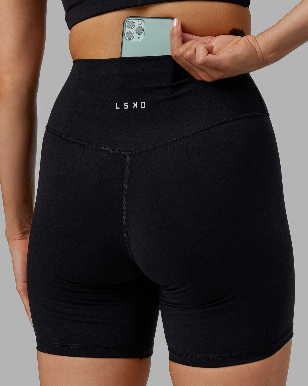 Woman wearing Base 2.0 Ultra High-Rise 6&quot; Short - Black