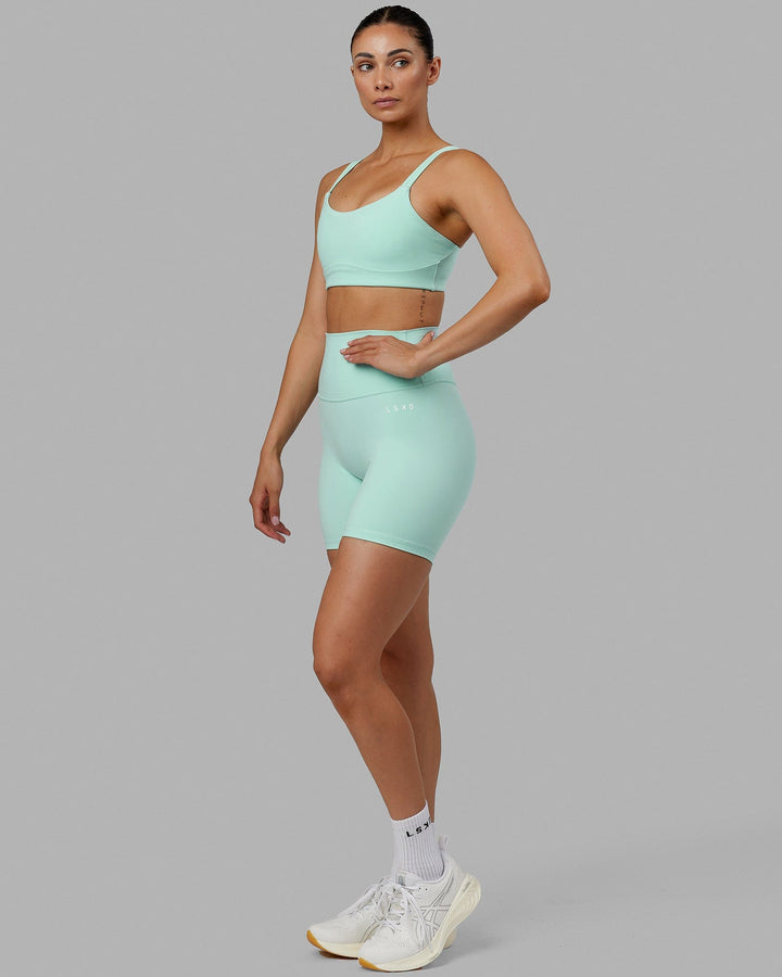 Woman wearing Base 2.0 Mid Short Tights - Pastel Turquoise
