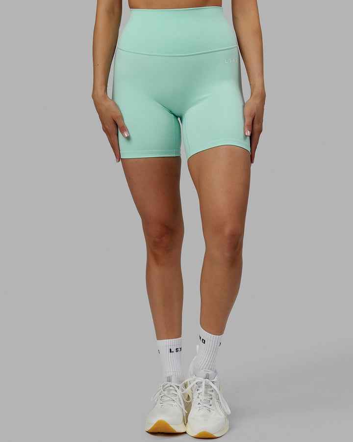 Woman wearing Base 2.0 Mid Short Tights - Pastel Turquoise
