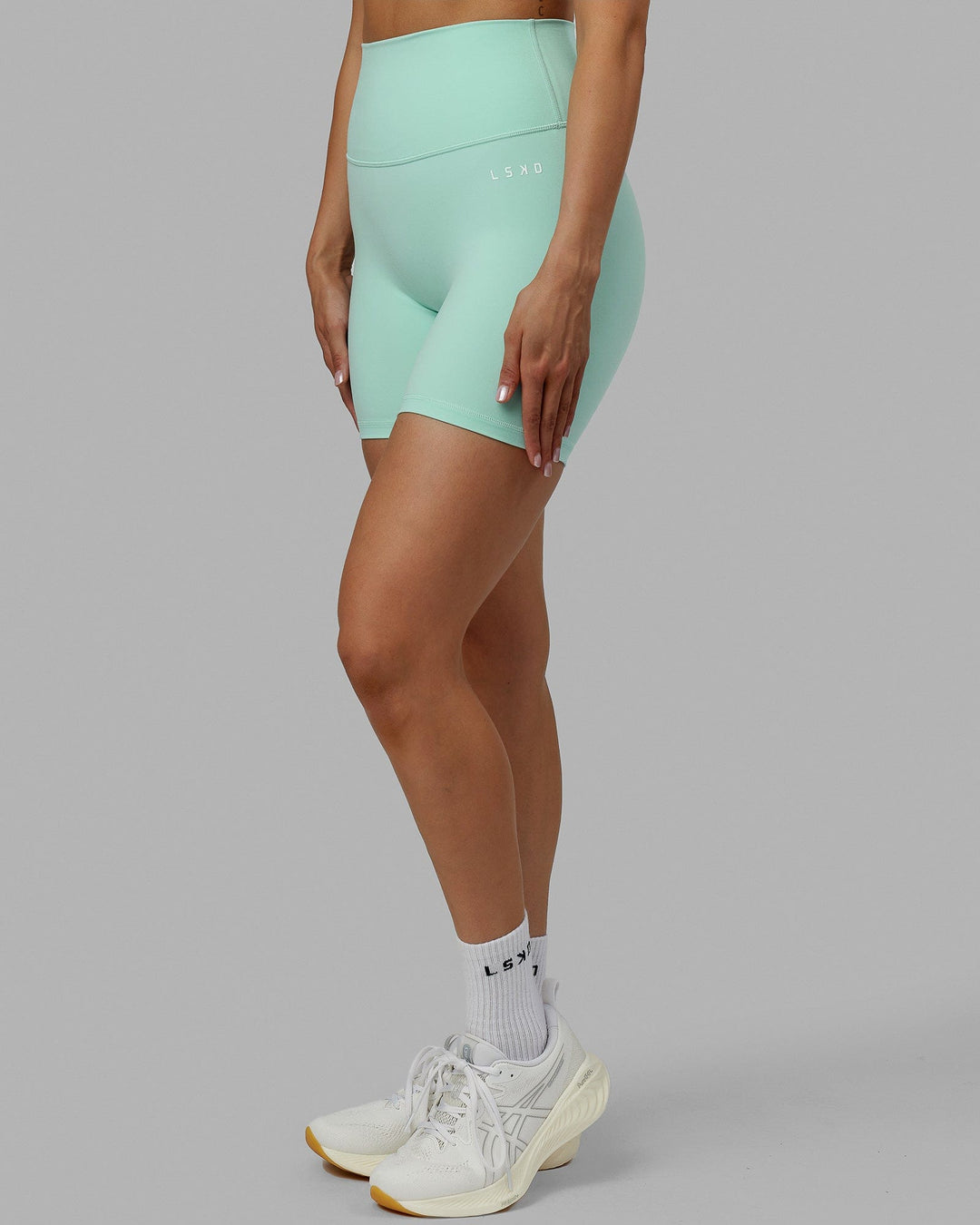 Woman wearing Base 2.0 Mid Short Tights - Pastel Turquoise