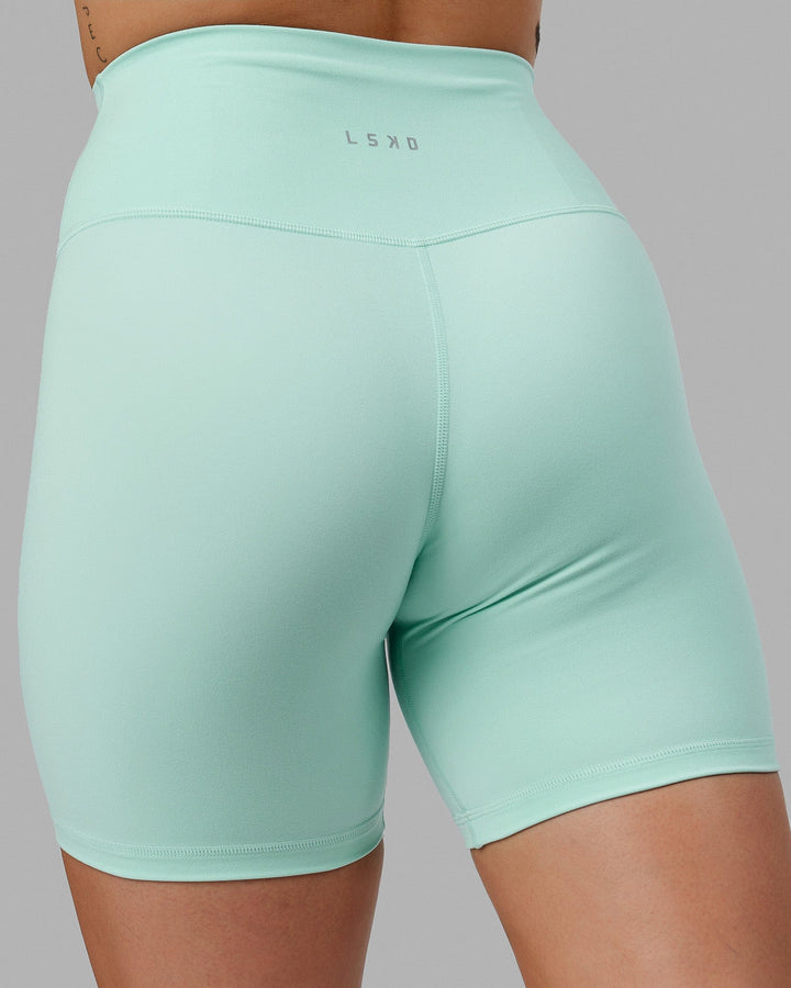 Woman wearing Base 2.0 Mid Short Tights - Pastel Turquoise
