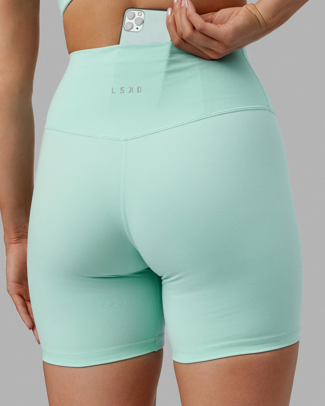 Woman wearing Base 2.0 Mid Short Tights - Pastel Turquoise