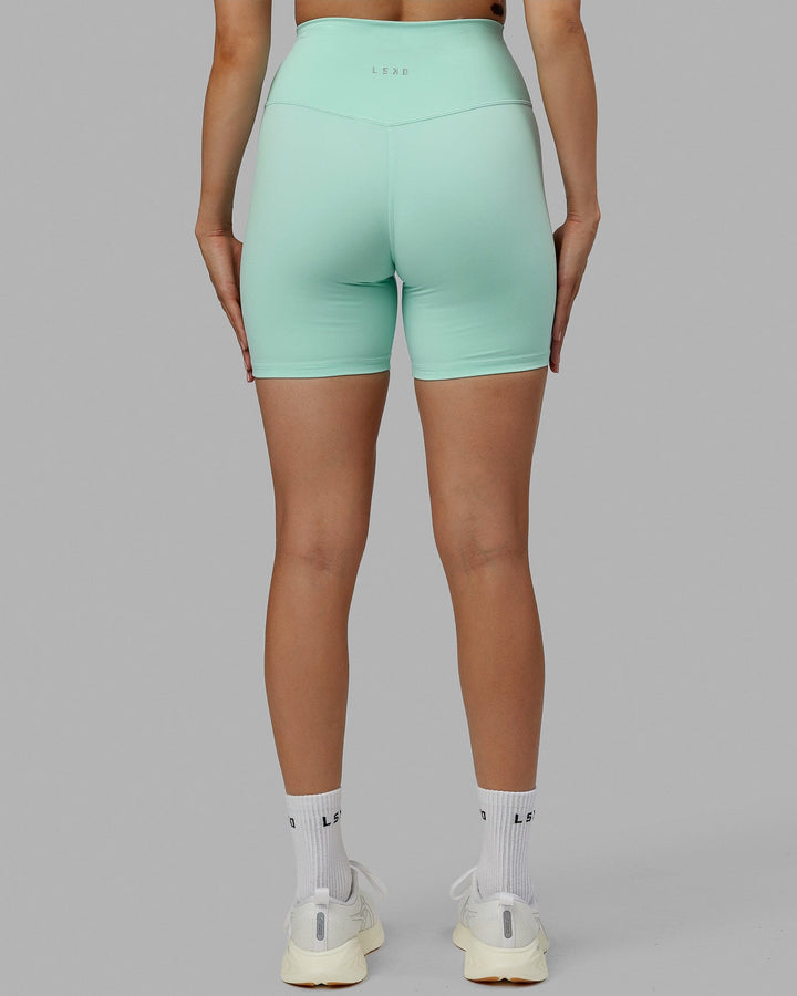 Woman wearing Base 2.0 Mid Short Tights - Pastel Turquoise
