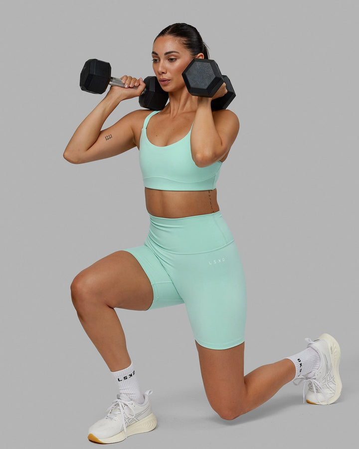 Woman wearing Base 2.0 Mid Short Tights - Pastel Turquoise

