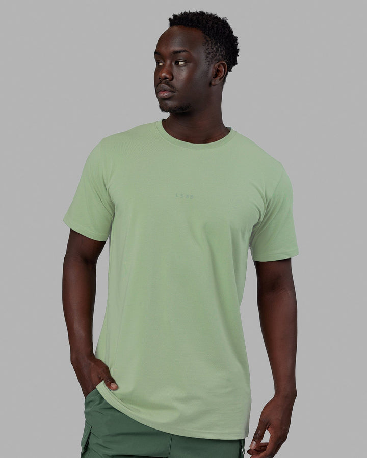 Man wearing Base FLXCotton Tee - Green Fig
