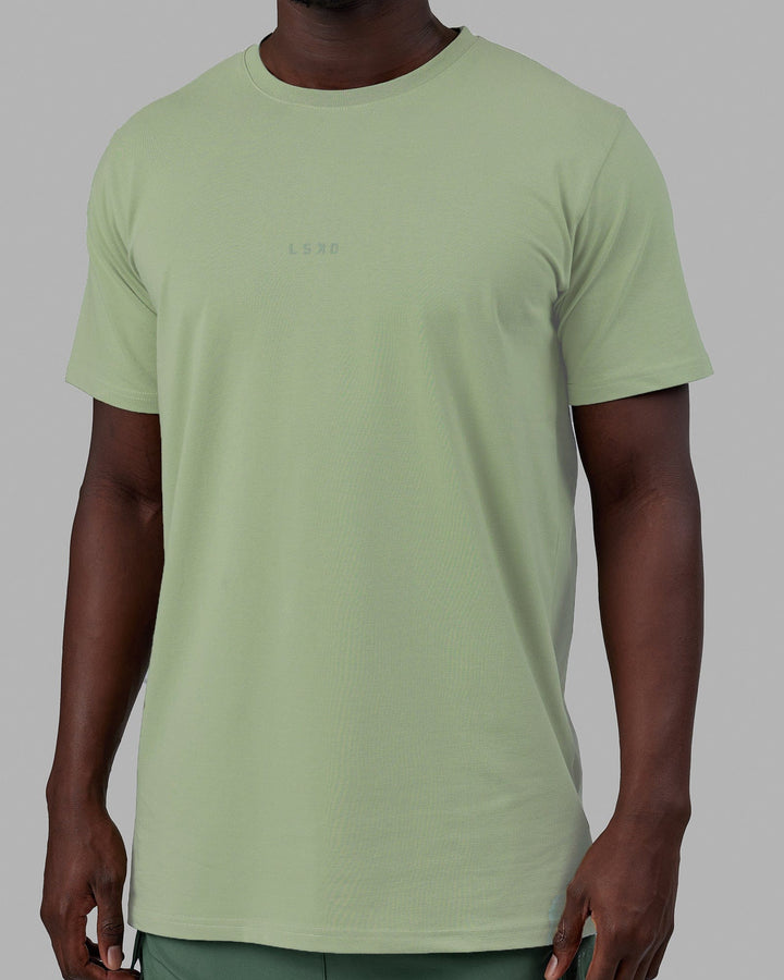 Man wearing Base FLXCotton Tee - Green Fig