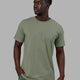 Man wearing Base FLXCotton Tee - Iceberg Green