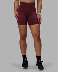 Woman wearing Bend Ultra High-Rise 6" Short - Dark Cherry